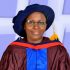 Professor Graceful Onovughe Ofodu of Ekiti State University, Nigeria. An African woman wearing a cap and gown as part of receiving her PhD
