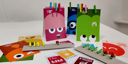 Brightly coloured games cards and playing pieces for the UN SDGs (Sustainable Development Goals)